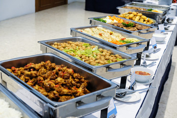 Close up  countertop food warmer and dish on table, catering concept