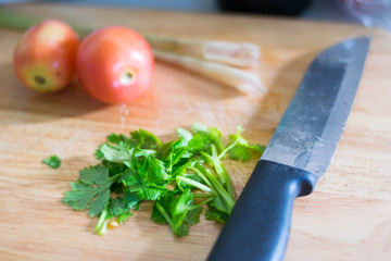 chef wooden board with vegetables slice