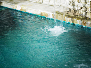 water falling into the spa pool