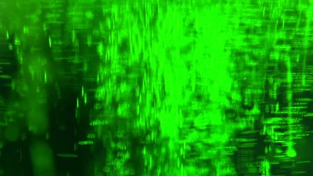 Liquid is bright green in a glass chemical flask: texture and processes of venturi. Reagents in chemical containers: colored chemical experiments. Concept chemistry, laboratory, chemical liquids.