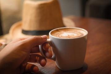 cappuccino on wood texture.