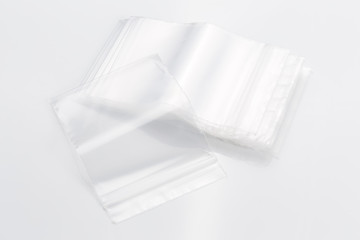 Empty transparent plastic bags on white background