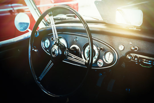 Interior view of classic vintage car. Instagram toning. Beautiful retro car poster, postcard.