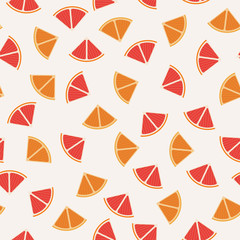 Tangerine, grapefruit and orange graphic design sliced in triangle pieces and arranged into seamless pattern background.