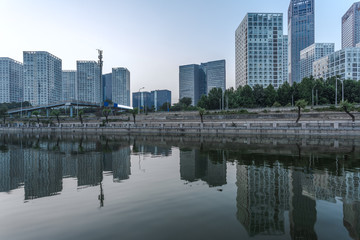 Fototapeta na wymiar River And Modern Buildings Against Sky in Tianjin,China.