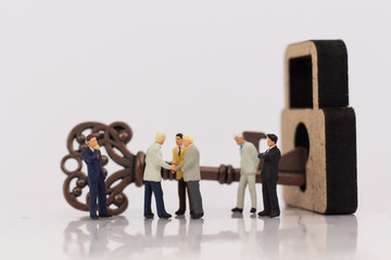 Miniature people : People help bring the key to unlock the master key, Business solution for run...