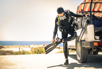 Scuba diver wearing fin