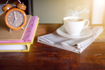 coffee cup clock and work on table