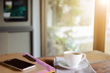 coffee cup clock and work on table