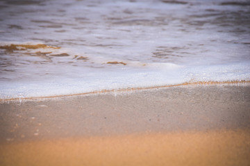 Waves breaking on a sandy beach