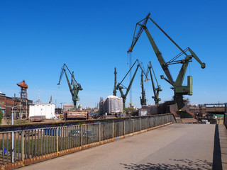 Fototapeta na wymiar Great, green shipbuilding cranes
