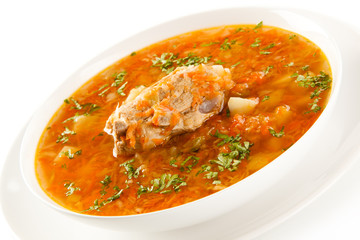 Vegetable soup with pork on white background