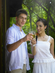 Man and woman with champagne glasses posing for the camera