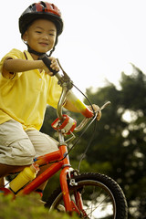 Naklejka premium Boy riding bicycle