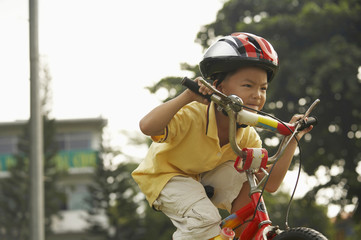 Boy riding bicycle