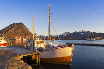 Fishing boats in harbor at midnight sun in Northern Norway, Lofoten Island, Ramberg, Norway