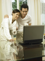 couple looking at the laptop