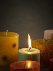 ..A lit candle among unlit ones