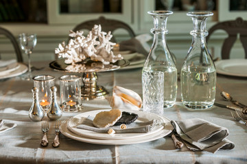 Served table with candles and bottles