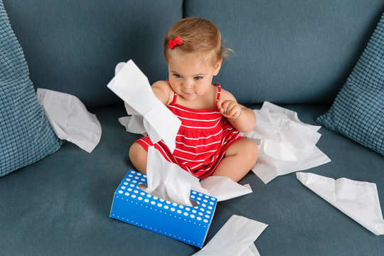 Toddler pulling tissues from box