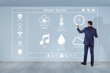 Businessman using smarthome interface on a wall 3D rendering