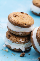 Vanilla ice cream sandwiches on blue background