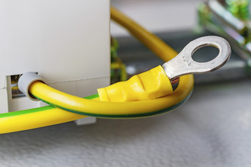Yellow ground cable with ring terminal closeup