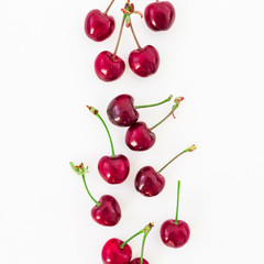 Juicy tasty cherries on white background. Flat lay. Top view. Red berries