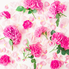 Pink rose flowers and pink petals on white background. Flat lay, top view. Floral pattern