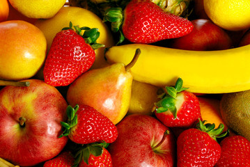 various kinds of fruit like strawberries, banana, apple, pear full frame 
