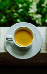 Invigorating fragrant coffee in the cup in the morning for breakfast