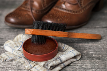 Brown shoes with brush and polish cream