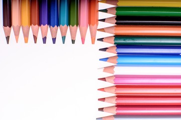 Many colored pencils isolated on white background, place for text