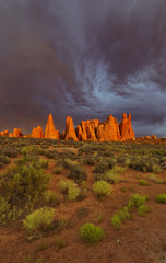 Vertical of dark storm clouds over pinnacles at Arches National Park in Utah