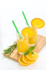 Fresh orange juice on white table