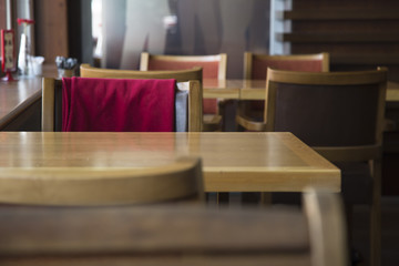 Fruit cocktail glass in cafe or restaurant - selective focus point. Healthy orange organic juice 