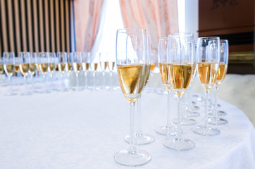 Champagne in the glases on the round table