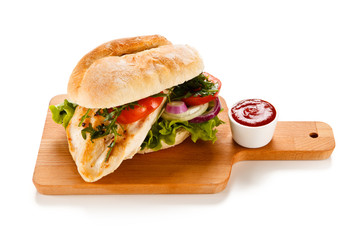 Sandwich with chicken fillet and vegetables
