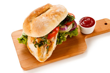 Sandwich with chicken fillet and vegetables
