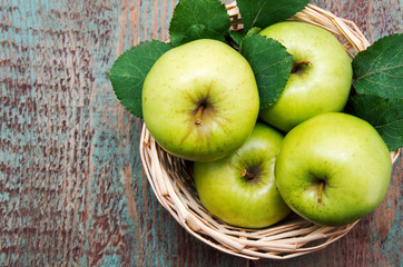 green apple on a wooden table.