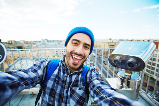 Happy tourist making selfie for vlog reportage