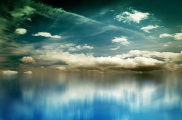 Fototapeta premium Blue sky with clouds over sea. Nature composition