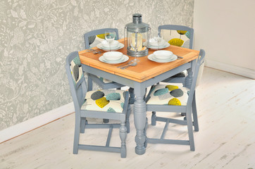 shabby chic dining table with chairs and tableware