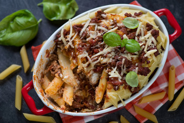 Above view of a baking dish with italian traditional ziti, horizontal shot