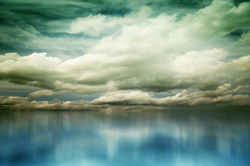 Blue sky with clouds over sea. Nature composition
