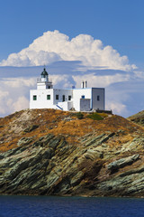 Fototapeta na wymiar Lighthouse in Korissia, the port of Kea island in Greece. 