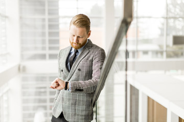 Fototapeta premium Modern businessman looking at his watch