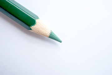 close up green colour pencils isolated on white background