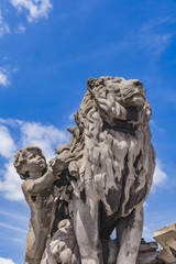 Sculpture Lion conduit par un enfant at Pont Alexandre III in Paris