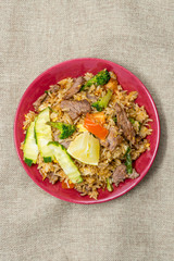 Homemade Chinese fried rice with vegetables and fried eggs